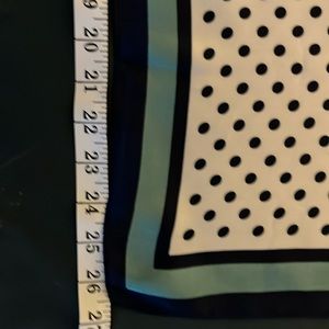 Scarf with black dots on white.
